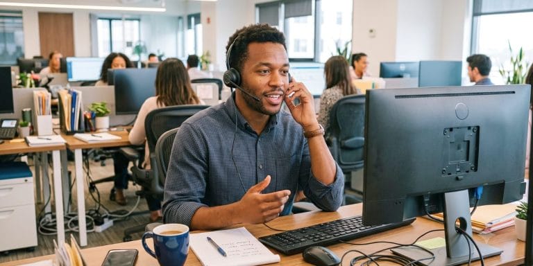 Sales rep on a call using sales engagement software